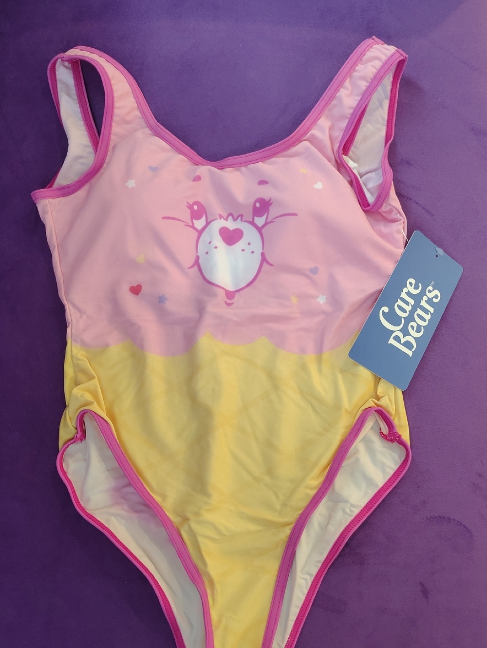 Care Bears Pink and Yellow Women's One-Piece Swim Suit with Heart Face Graphic